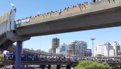 Crowd of people on bridge