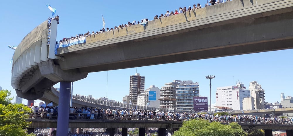 Crowd of people on bridge