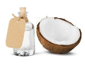 Coconut together with a coconut Oil bottle