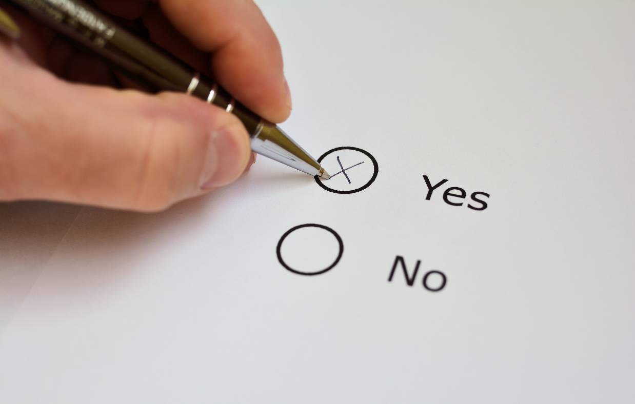 Crossing the YES in a yes or no questionnaire.