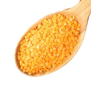 Red Lentils on a wooden spoon