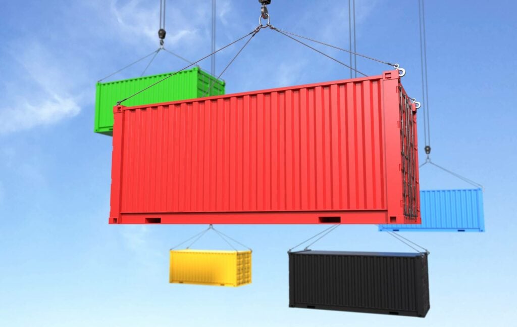 Containers being unloaded from a ship, mid-air