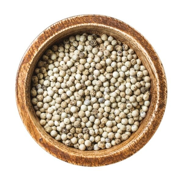 Whole white peppercorns in a bowl