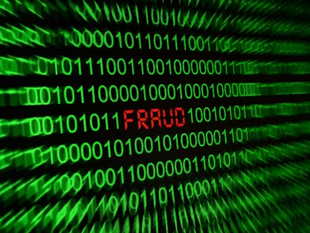 green computer code with "fraud" written in the middle in red