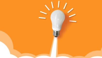 A glowing light bulb rising to signify 'innovation'