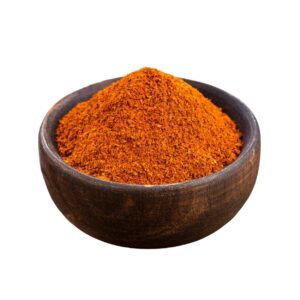 Reddish-orange powder in a wooden bowl