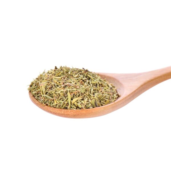 Green herbs on a wooden spoon,
