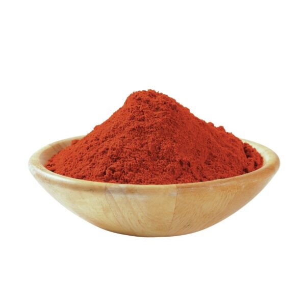 Reddish-orange powder in a wooden bowl.