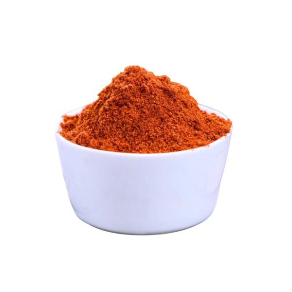 Reddish-orange powder in a white bowl