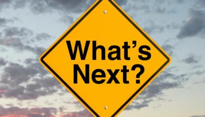Yellow street sign that says "What's next?"