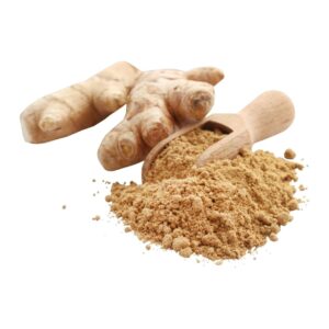 Ginger root beside ginger powder and a spoon
