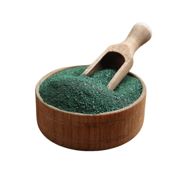 Dark green powder in a wooden bowl.