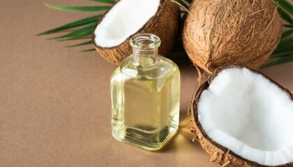 coconut oil and a bowl of coconut oil on a white wooden table