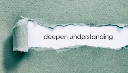 the word deep understanding is hidden behind torn paper stock photo
