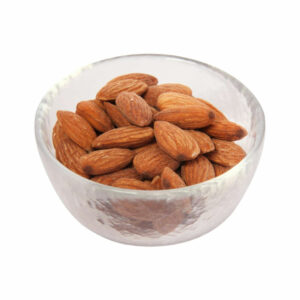 Whole almonds nuts in a transparent bowl.