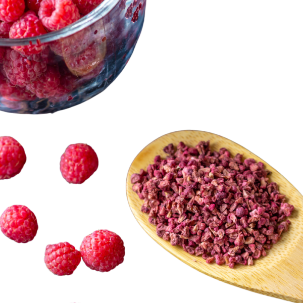 Raspberry pieces on a wooden spoon