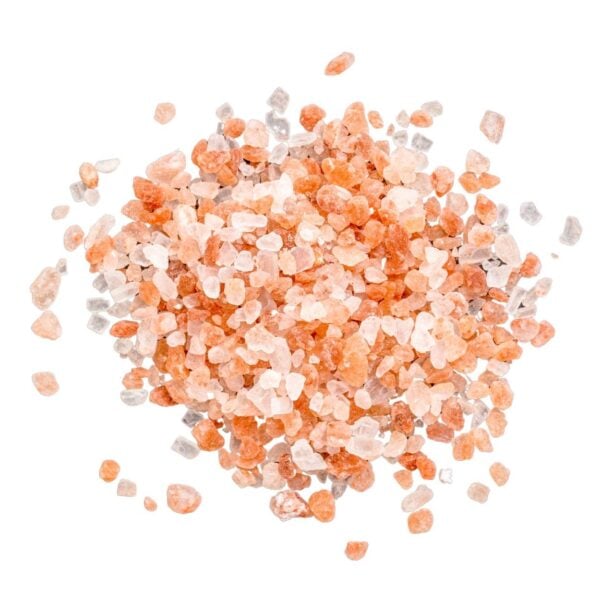 Granules of pink and white salt in a heap