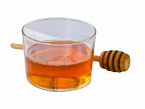 Golden syrup in a transparent bowl