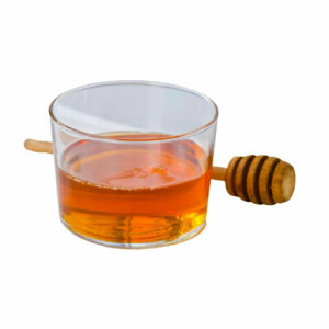 Golden syrup in a transparent bowl