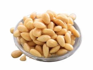 Peeled almond nuts in a bowl.