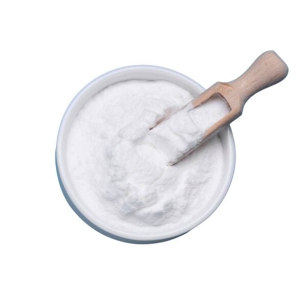 Top view of white powder in a bowl being scooped out with a wooden scooper.