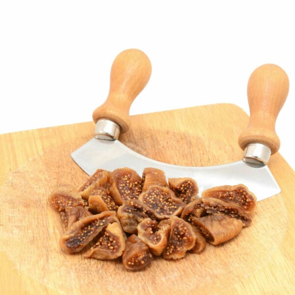 Dried pieces of fig beside a knife