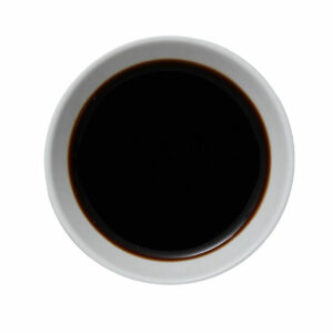 Top view of dark liquid in a cup