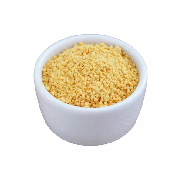 Golden grains in a white bowl