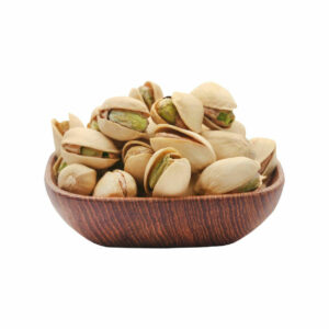 Shelled pistachios in a wooden bowl.