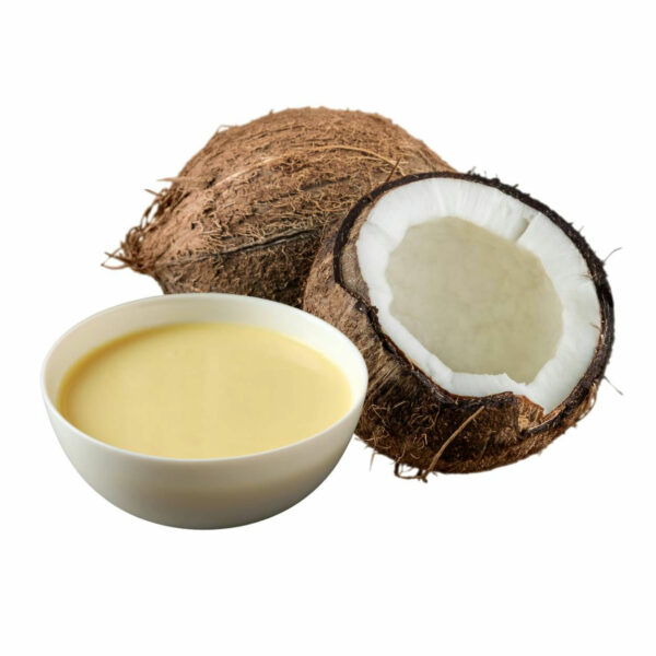 Yellowish milk in a bowl beside an open coconut fruit.
