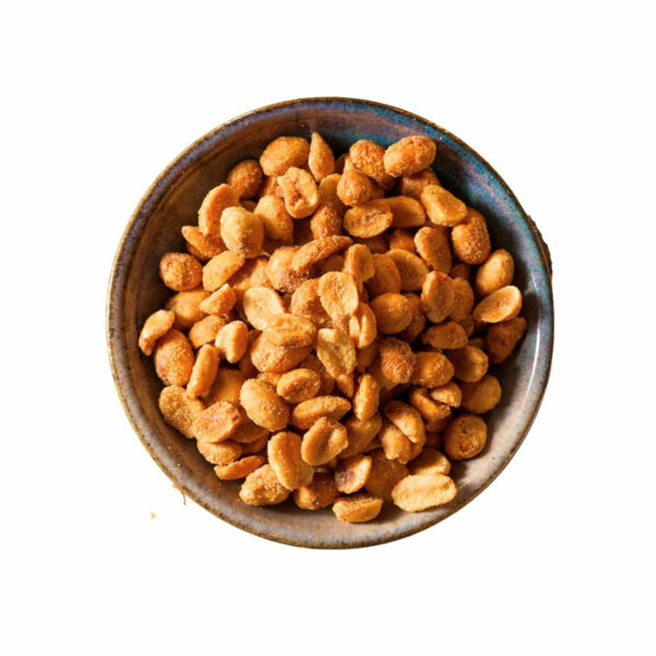 Top view of golden peanuts in a bowl