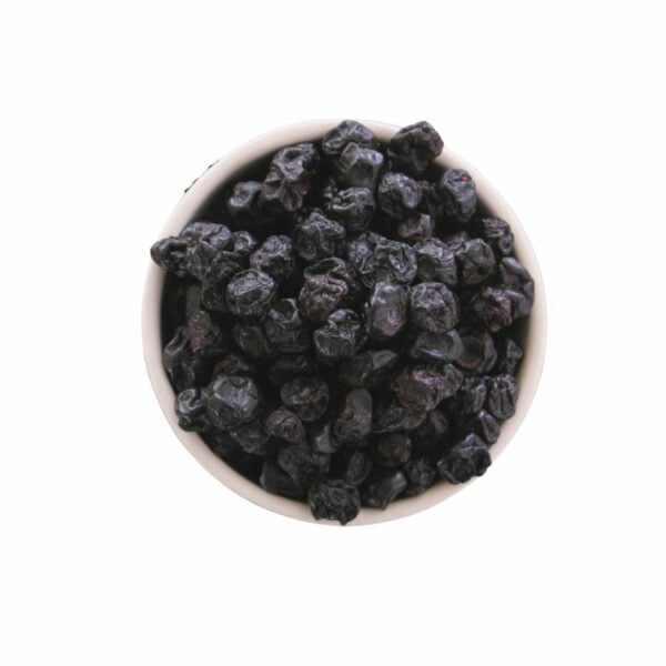 Dark, dried berries in a bowl shown from the top view.
