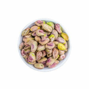 Top view of whole pistachios in a bowl.