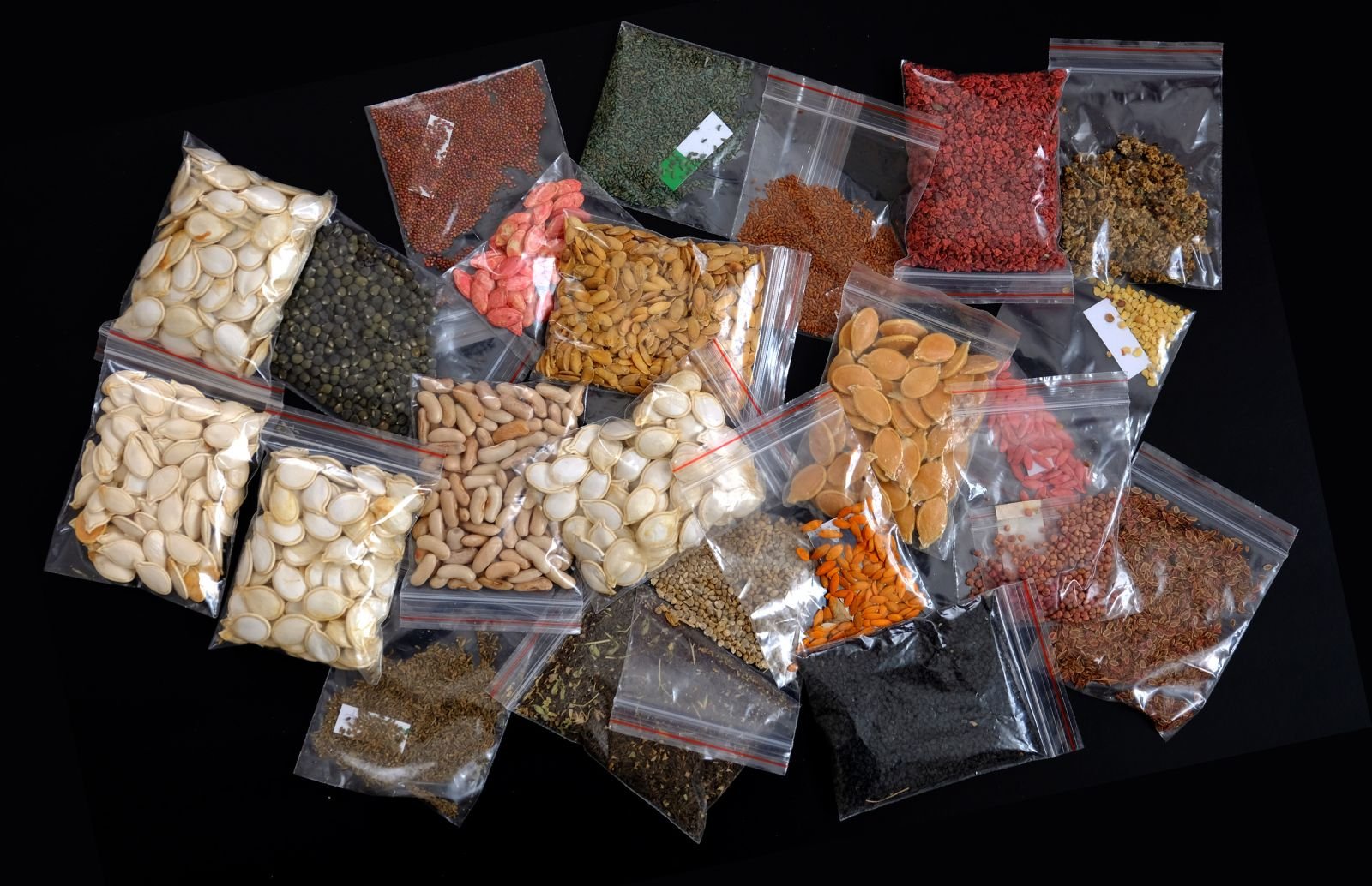 a variety of spices and nuts in plastic bags