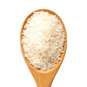 Top view of rice grains on a wooden spoon.