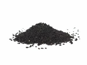 A pile of black seeds on a white background