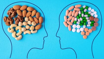 two heads with different types of nuts and pills in them
