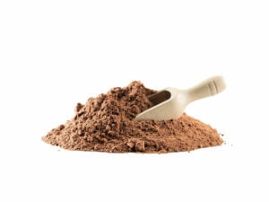Brown, fine powder in a heap, displayed with a wooden spoon.