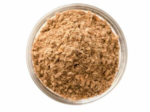Top view of light brown powder spice in a bowl.