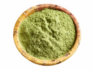Top view of fine green powder in a bowl.