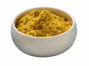 Mustard yellow, fine powder in a bowl.