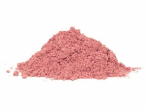 Salmon-pink powder in a heap.