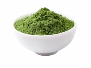 Vibrant green powder in a bowl.